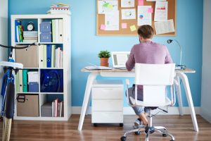 man studying at organized desk